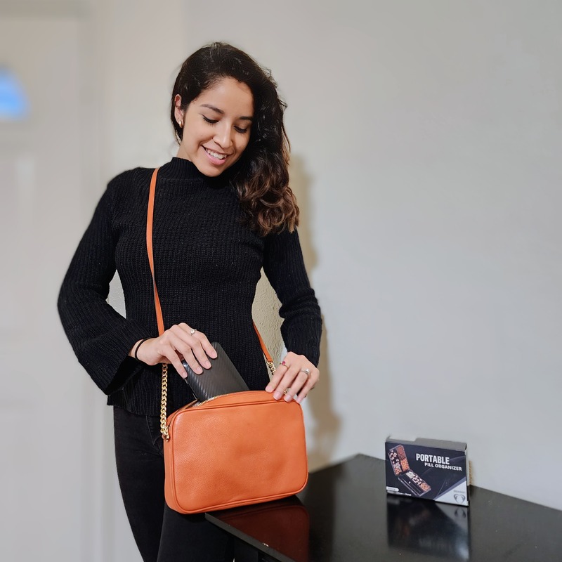 Lifestyle shot with a portable pill organizer — UGC by Natalí Zette